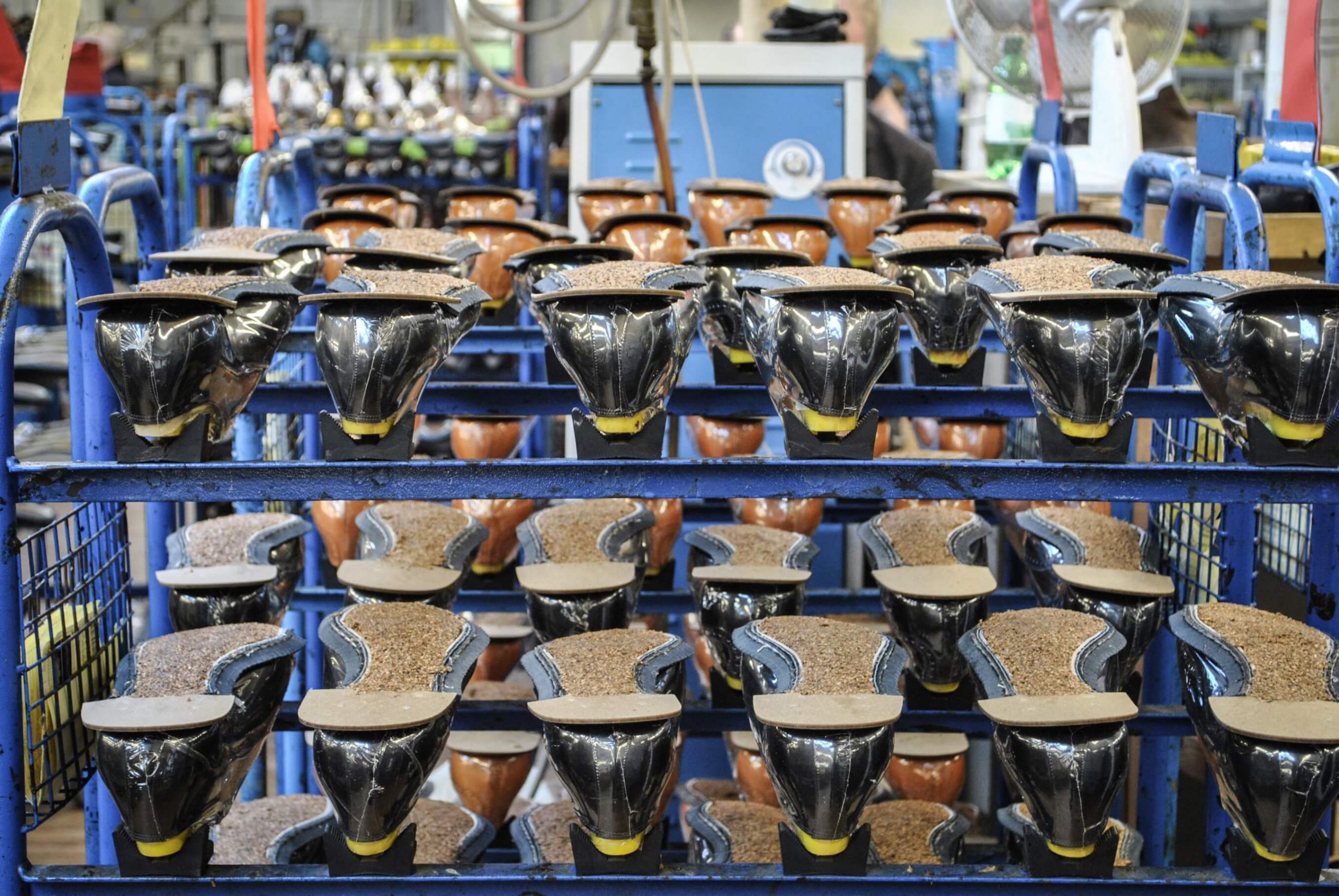 What’s a Goodyear Welt? Image of rows of Goodyear welted shoes going through the Goodyear welting process in the Cheaney Shoes factory.