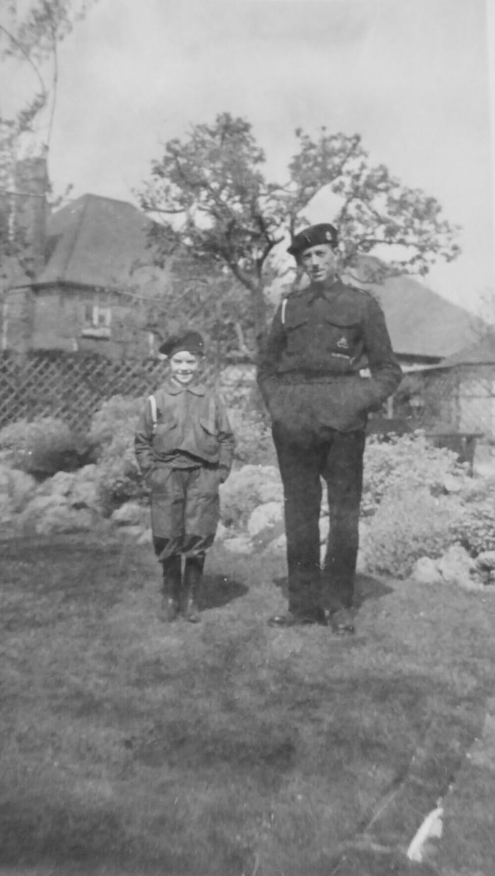 This later photograph captures the grandfather in the updated Civil Defence "battledress" uniform. Distinctive for its extremely dark blue colour (contrasting with the standard army khaki), this uniform is worn alongside what are believed to be the very same 1942 Cheaney leather boots that remain safely in the Barr family’s possession today.